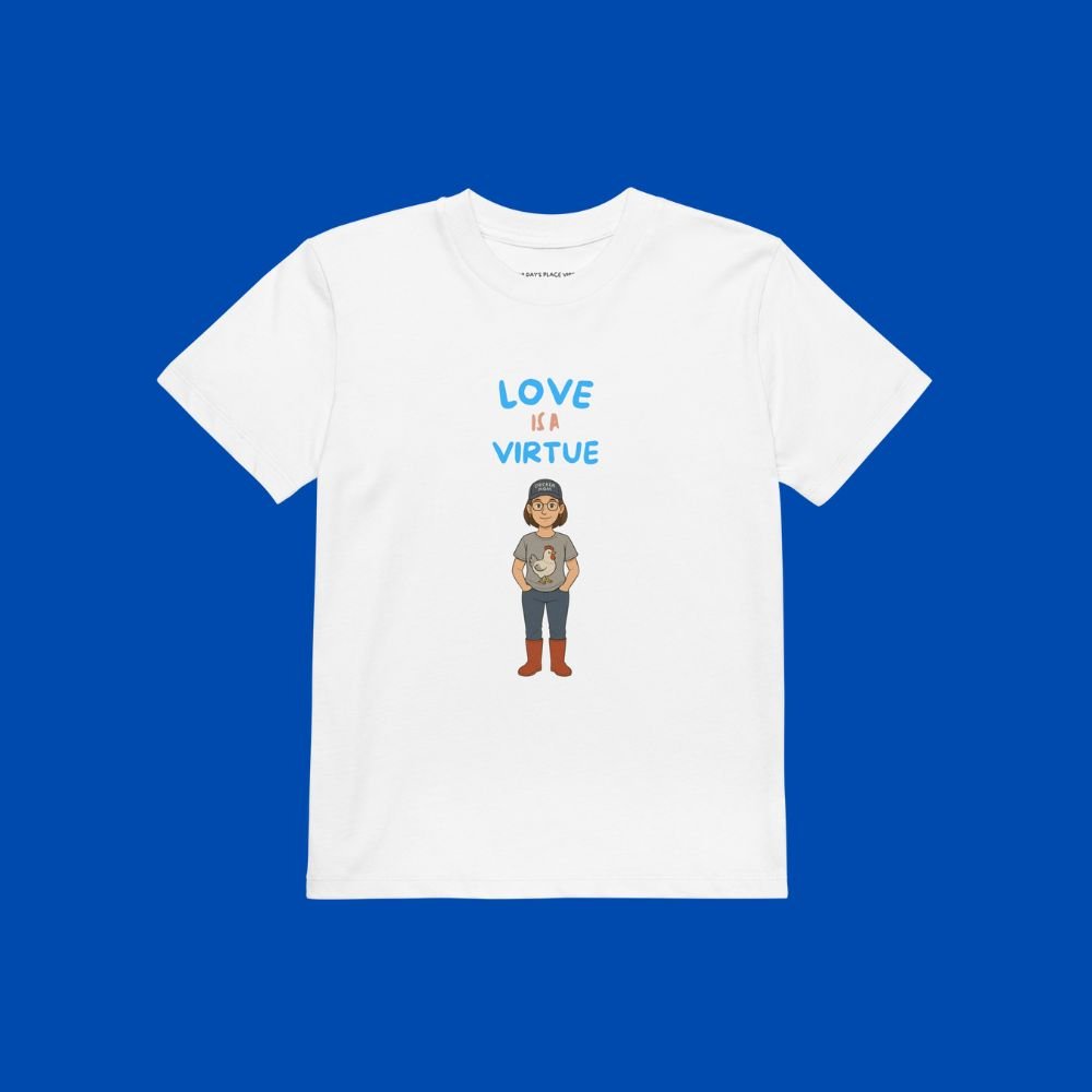 A white child's tee with Miss Tater on the front and saying Love is a virtue
